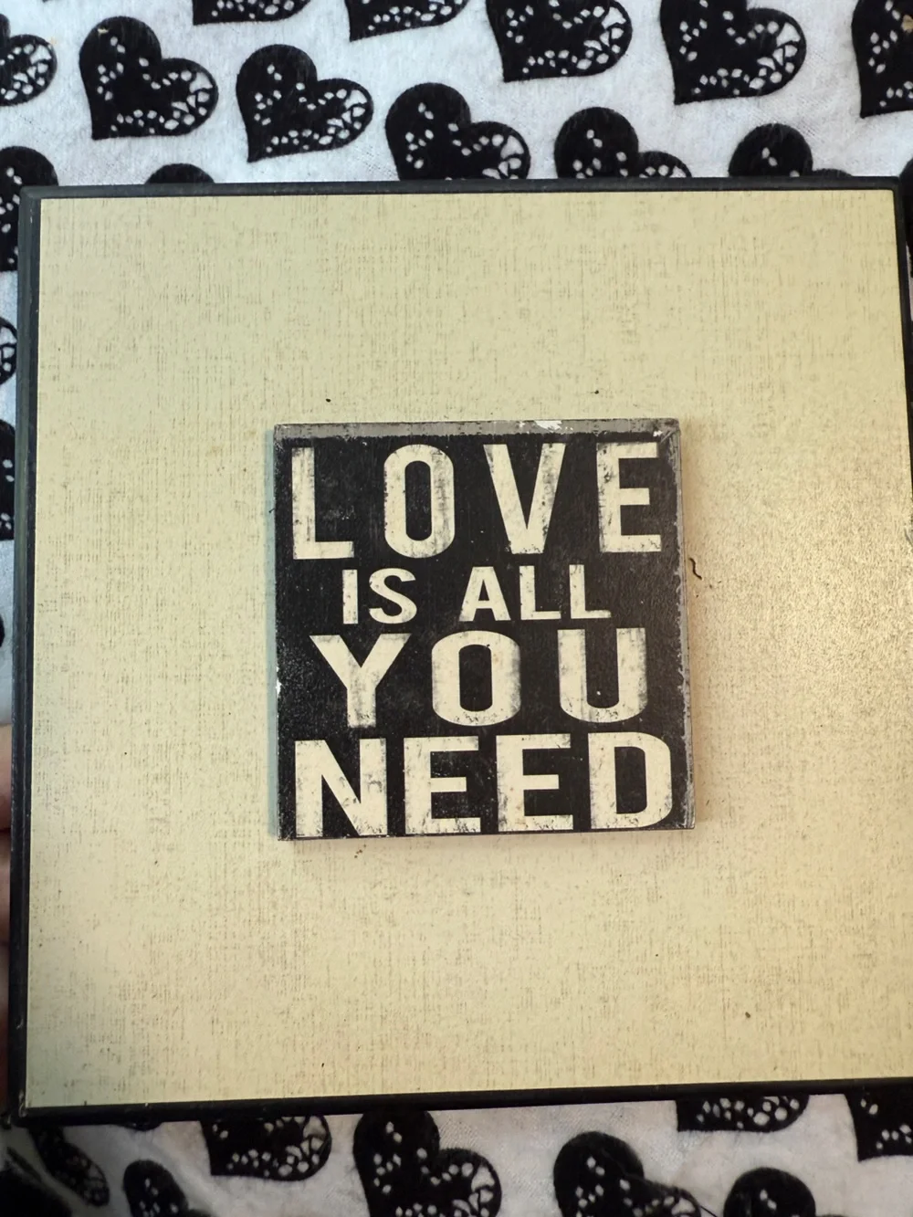 inspirational wall plaques feature distressed black typography on a white